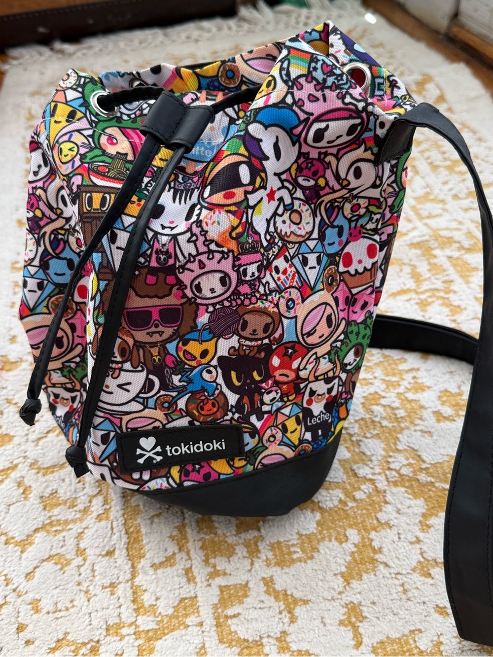 tokidoki Multicolor Graphic Print Drawstring Bucket Crossbody Bag Black Strap